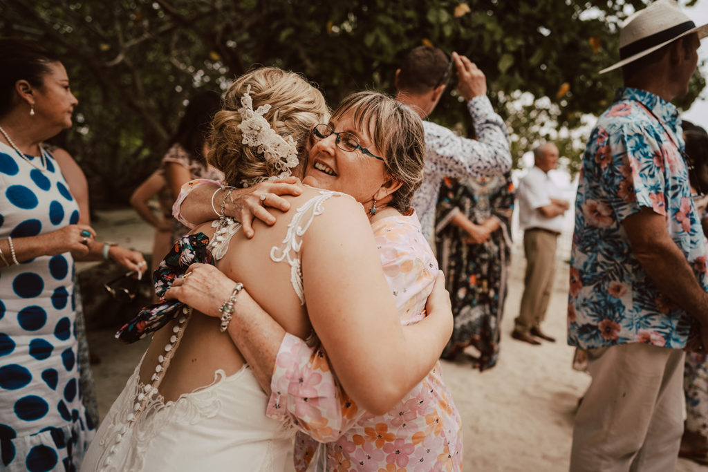 Bride hugging guest after wedding ceremony on Erakor island