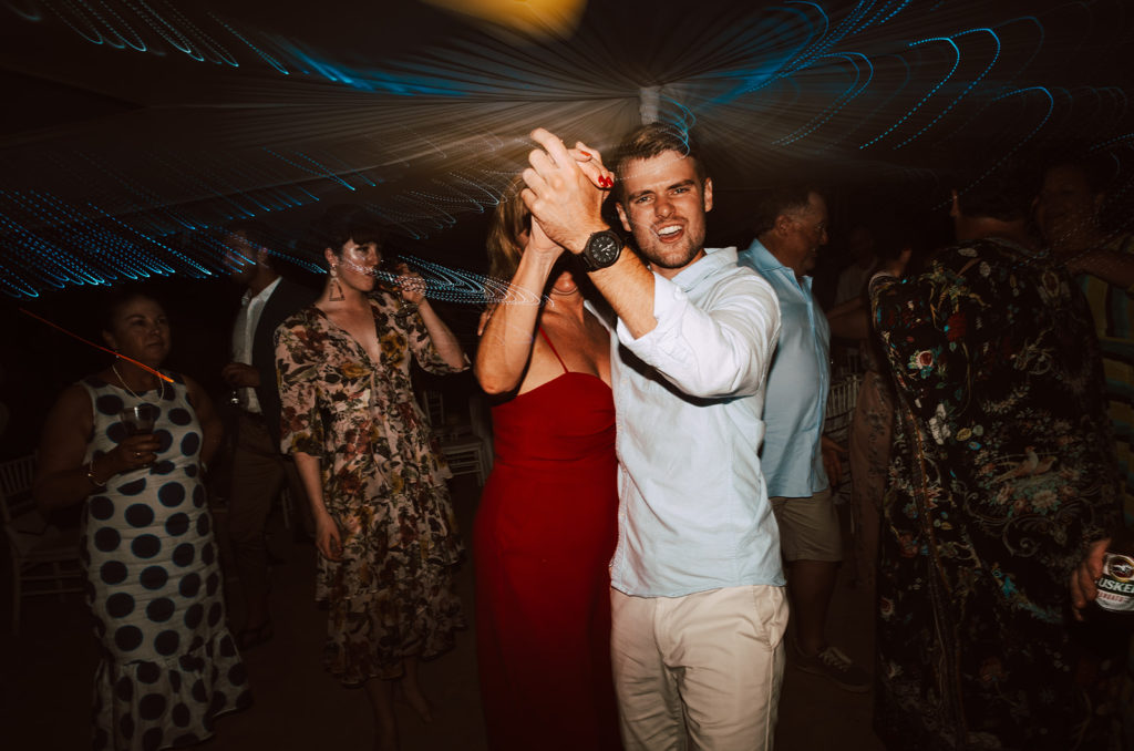 Guests dancing during wedding reception on Erakor island